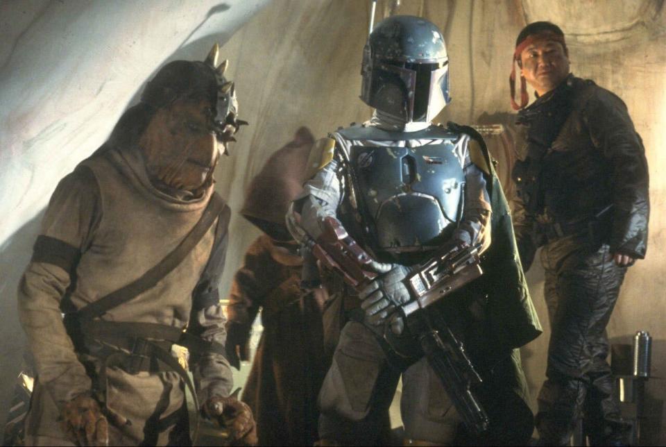 Boba Fett (center) eyes the other denizens of Jabba's place after delivering Han Solo to the gangster in "Return of the Jedi."