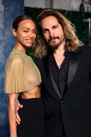 <p>Cindy Ord/VF23/Getty</p> Zoe Saldana and Marco Perego