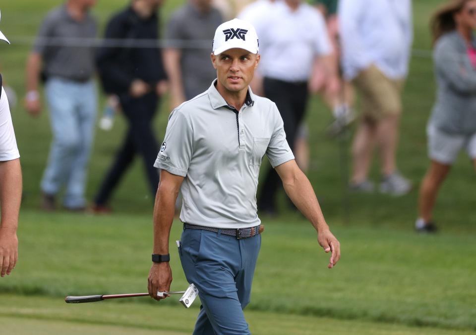 Eric Cole walks up to the green on the 8th hole.