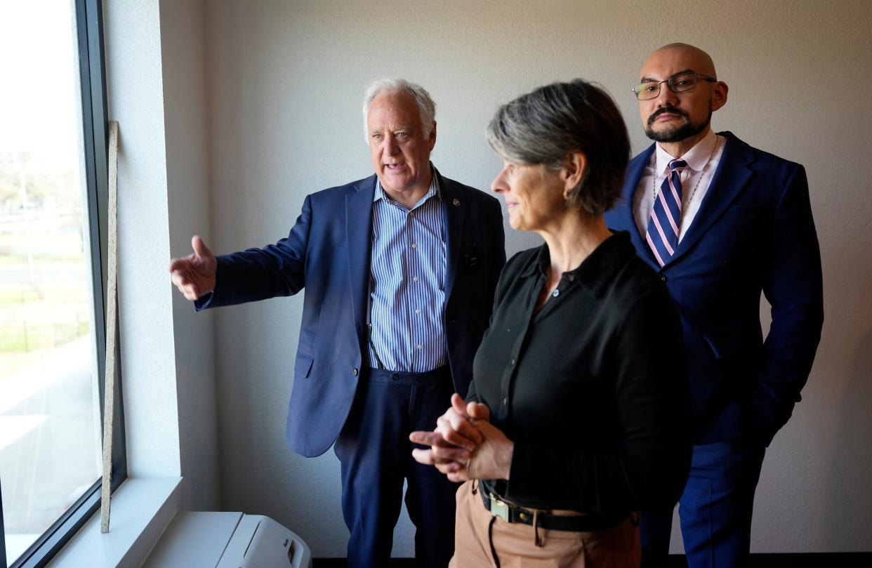 Family Eldercare CEO Aaron Alarcon, right, and Senior Program Director Shontell Gauthier show a room to Mayor Kirk Watson at Pecan Gardens on Thursday February 22, 2024. Pecan Gardens by Family Eldercare, will provide permanent supportive housing for elderly homeless people.