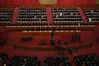 Delegates attend the opening session of China's National People's Congress (NPC) at the Great Hall of the People in Beijing, Sunday, March 5, 2023. (AP Photo/Ng Han Guan)