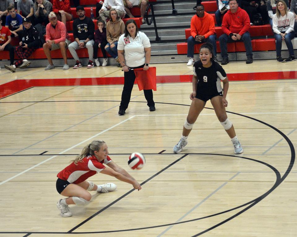 North Hagerstown's Marley Knight makes a serve-receive pass as teammate Gabby Grantham-Medley watches during a Maryland Class 3A volleyball quarterfinal against River Hill at North on Nov. 11, 2022.