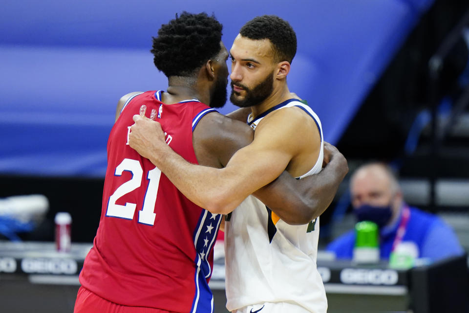 Philadelphia 76ers' Joel Embiid, left, and Utah Jazz's Rudy Gobert meet after an NBA basketball game, Wednesday, March 3, 2021, in Philadelphia. (AP Photo/Matt Slocum)