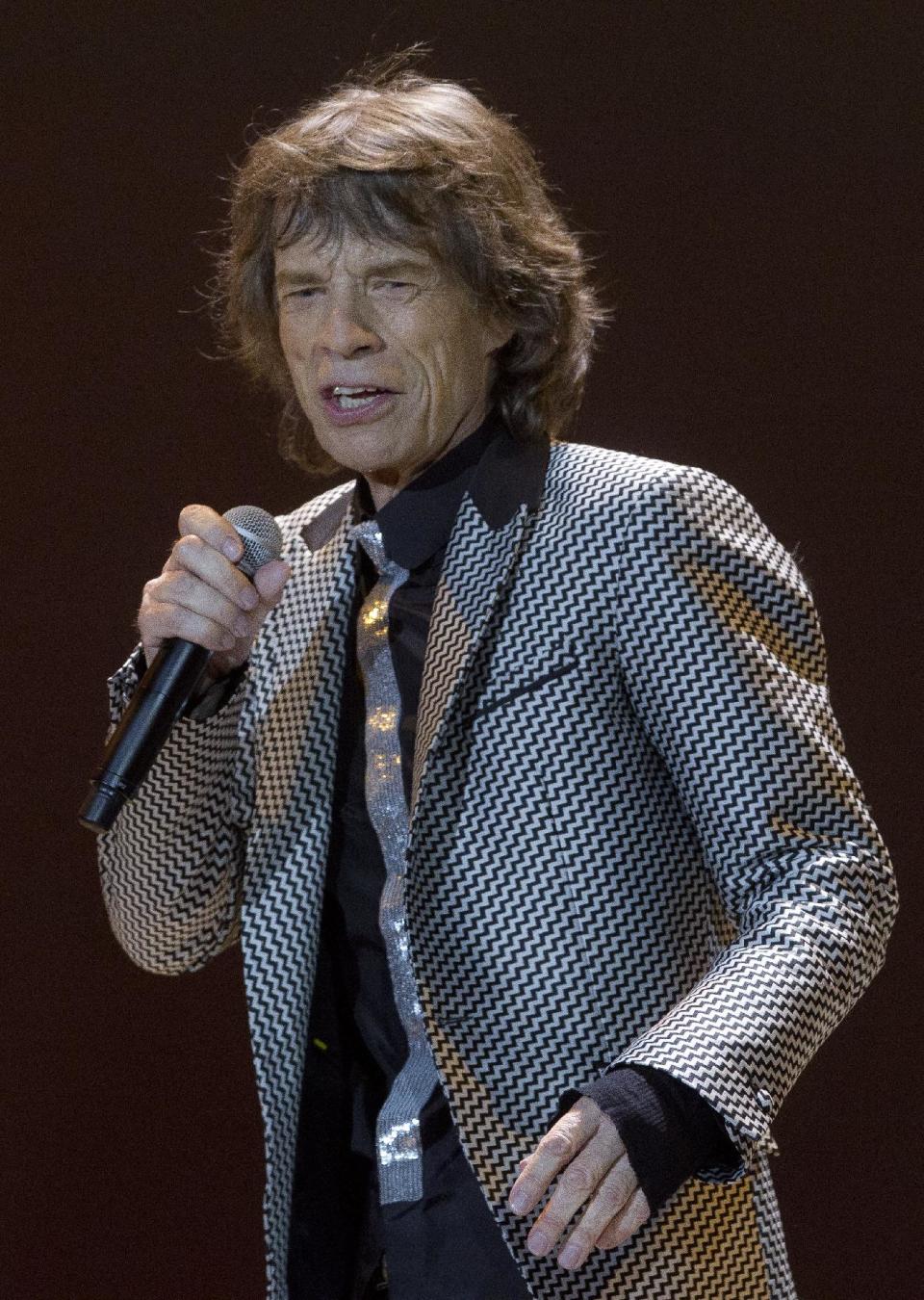 Mick Jagger of The Rolling Stones performs at the O2 arena in east London, Sunday, Nov. 25, 2012. The band are playing four gigs to celebrate their 50th anniversary, including two shows at London’s O2 and two more in New York. (Photo by Joel Ryan/Invision/AP)