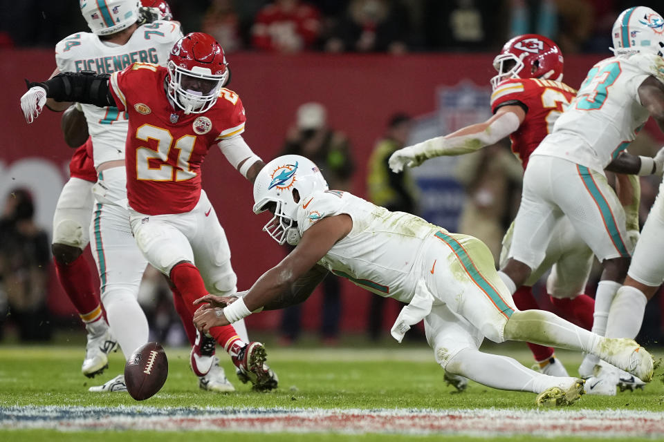 Miami Dolphins quarterback Tua Tagovailoa, center, fumbles late in the second half of an NFL football game against the Kansas City Chiefs Sunday, Nov. 5, 2023, in Frankfurt, Germany. (AP Photo/Martin Meissner)