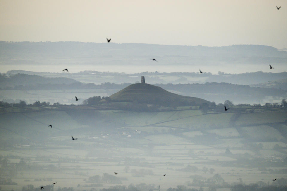 FILE - This Dec. 19, 2017 file photo shows Glastonbury Tor in Glastonbury, England, which is cared for by the National Trust. Britain’s National Trust which looks after hundreds of the country’s well-loved historic sites, published a report Tuesday Sept. 22, 2020, said 93 of its sites have connections with aspects of the global slave trade or Britain’s colonial history. Glastonbury Tor is shown to have links to successful compensation claims as a result of the abolition of slavery,. (Ben Birchall/PA via AP, File)