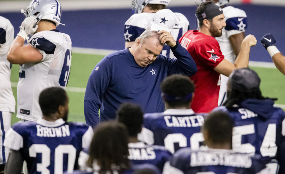 Dallas Cowboys head coach Mike McCarthy scratches his head during an NFL football training camp practice at The Star, Friday, Aug. 28, 2020, in Frisco, Texas. (AP Photo/Brandon Wade)