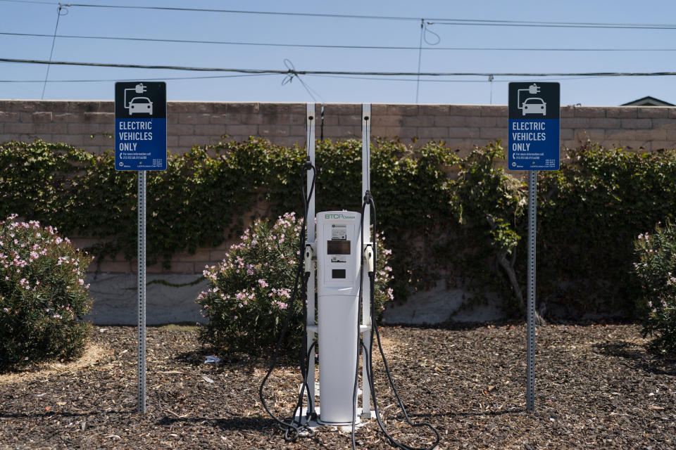 An electric vehicles is seen in the parking lot of a metro station in Norwalk, Calif., Monday, Aug. 29, 2022. Discounted prices, car-share programs, and a robust network of public charging stations are among the ways California will try to make electric vehicles affordable and convenient for people of all income levels as it phases out the sale of new gas cars by 2035. Advocates for the policy say the switch from gas- to battery-powered cars is a necessary step to reducing pollution in disadvantaged neighborhoods, but that the state make sure those residents can access the cars, too.(AP Photo/Jae C. Hong)