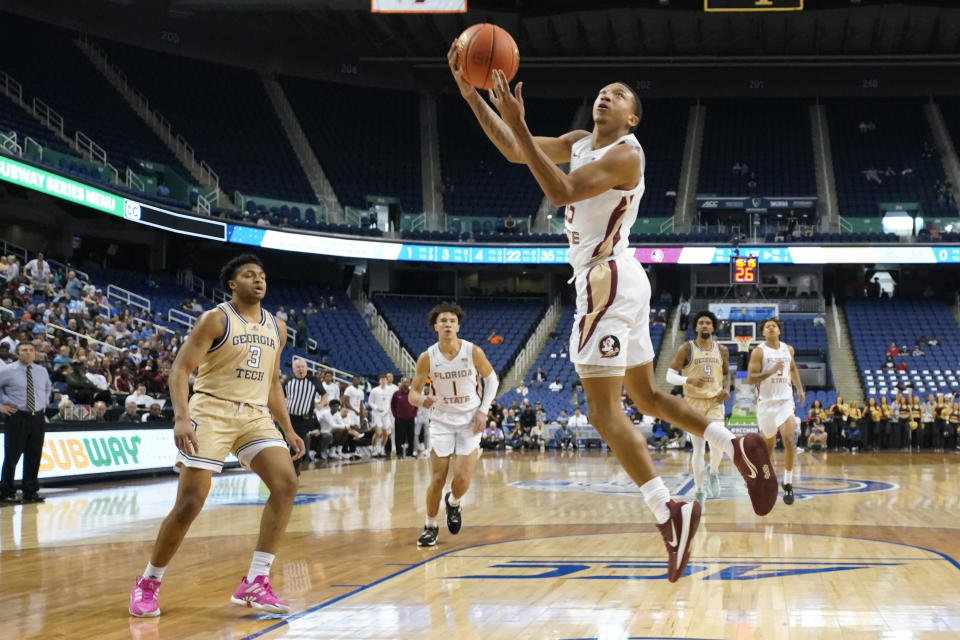 Florida State guard Matthew Cleveland (35) shoots against Georgia Tech's Dallan Coleman (3) during the first half of an NCAA college basketball game at the Atlantic Coast Conference Tournament in Greensboro, N.C., Tuesday, March 7, 2023. (AP Photo/Chuck Burton)