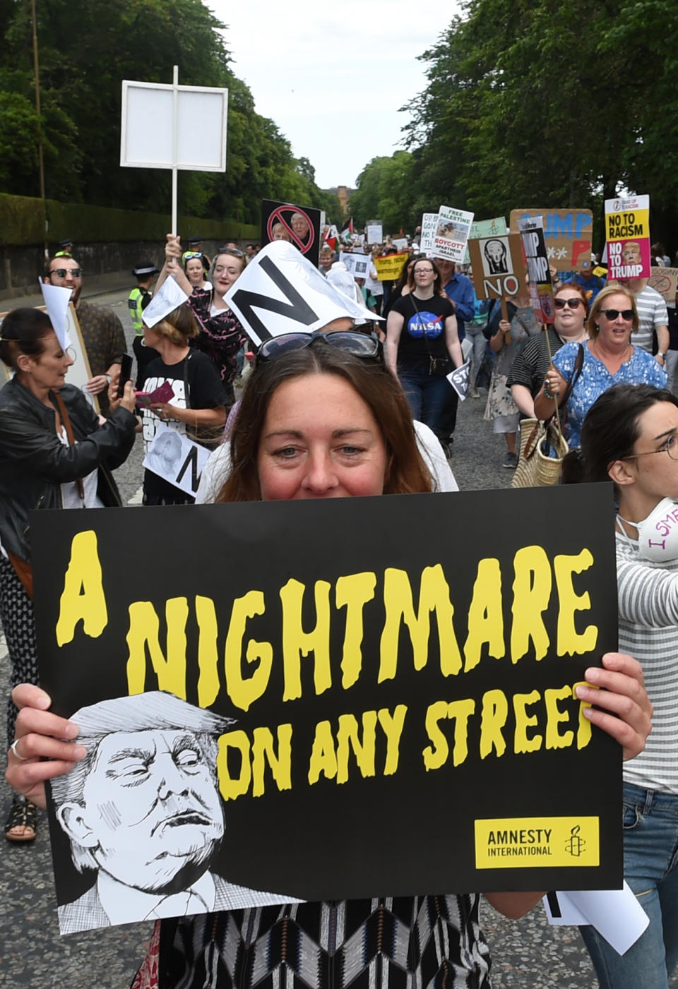 <p>Scotland United Against Trump demonstrators march through Edinburgh, Scotland, during a “Carnival of Resistance” to protest the visit of President Trump to the U.K., Saturday, July 14, 2018. (Photo: Lesley Martin/PA via AP) </p>