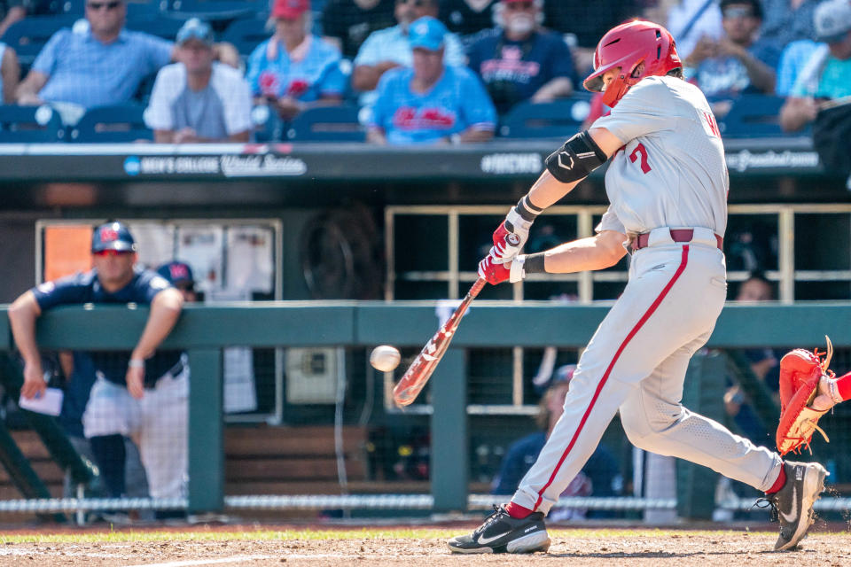 Jun 23, 2022; Omaha, NE, USA; Arkansas Razorbacks third baseman Cayden Wallace (7) lines out to right field to end the sixth inning against the Ole Miss Rebels at Charles Schwab Field. Mandatory Credit: Dylan Widger-USA TODAY Sports