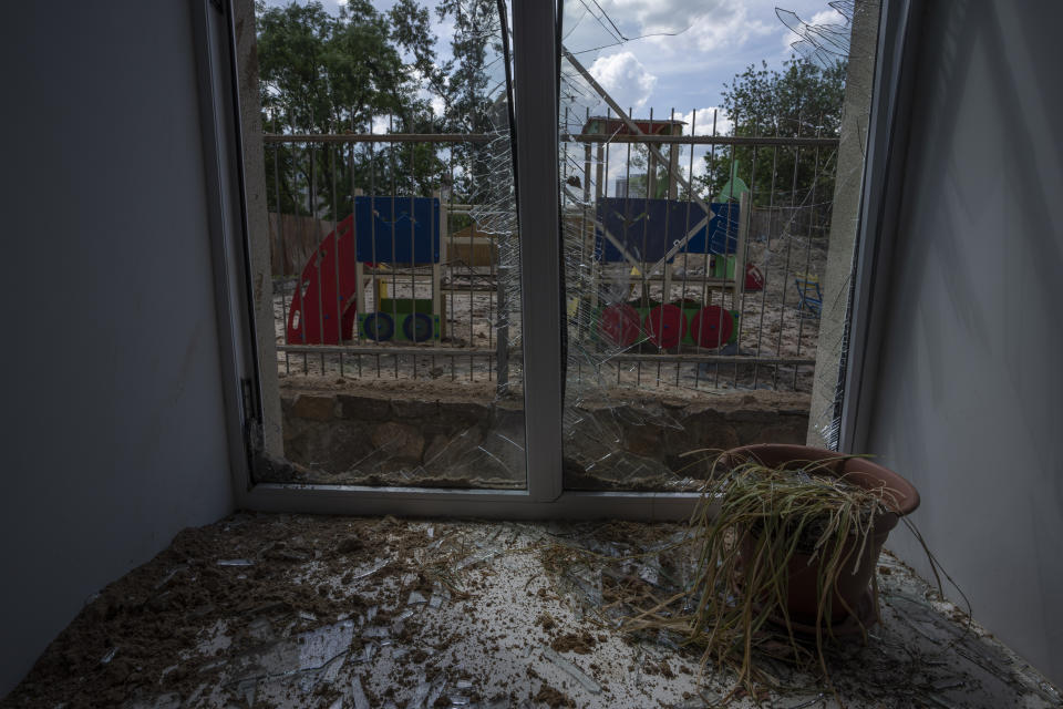 Damages seen in the classroom of a kindergarten in the aftermath of Russian missile strikes fired toward Kyiv early Sunday, where a crater pocked the courtyard, in Kyiv, Ukraine, Monday, June 27, 2022. (AP Photo/Nariman El-Mofty)