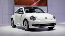 Volkswagen just unveiled the 2013 Volkswagen Beetle TDI, an oil-burning version of the recently revised and manliness-infused Beetle. America's only diesel two-door (VW considers this a coupe and the Golf a hatch) will go on sale this summer. The engine is VW's familiar 2.0 liter turbocharged and direct-injected 4-cylinder, now sporting a common-rail fuel injection setup and putting 140 horsepower and 238 lb/ft of torque into your choice of six-speed transmissions: either a traditional manual or the DSG semiautomatic. EPA fuel economy scores of 29 mpg city and 39 mpg highway have been confirmed.