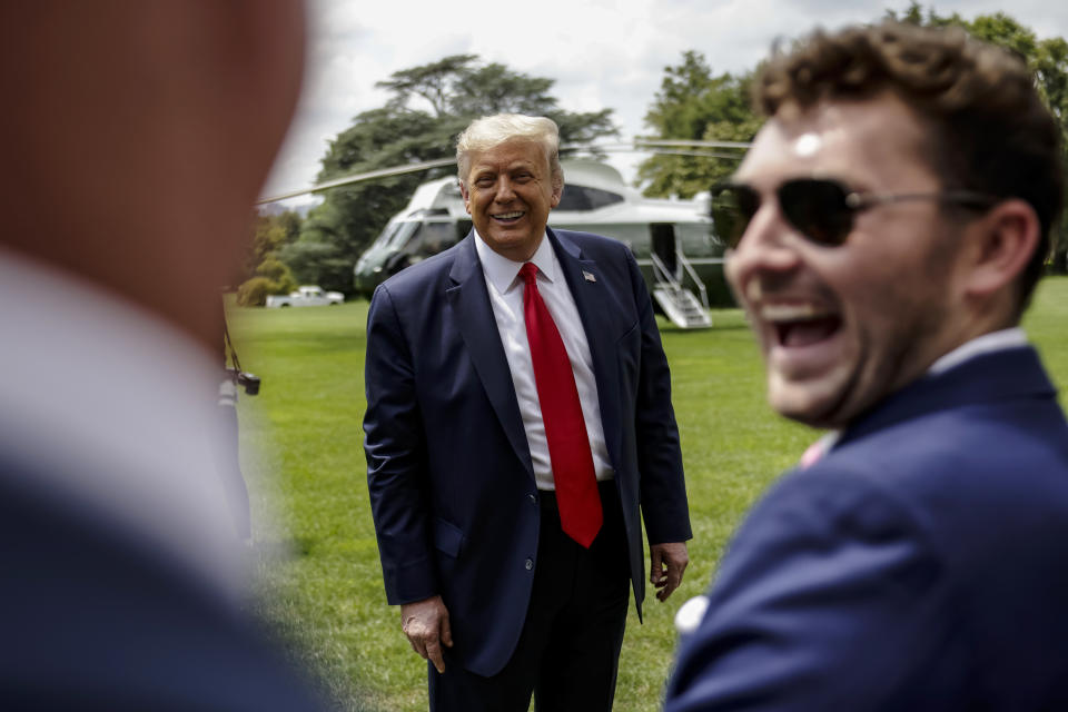 President Donald Trump jokes with supporters as he departs the White House for a trip to Ohio where he will visit a Whirlpool factory on August 6, 2020 in Washington, DC. (Samuel Corum/Getty Images) 