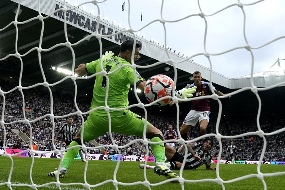 Newcastle United's Sandro Tonali, right, scores their side's first goal of the game during the Premier League soccer match between Newcastle United and Aston Villa at St. James' Park, Newcastle upon Tyne, England, Saturday Aug. 12, 2023. (Owen Humphreys/PA via AP)