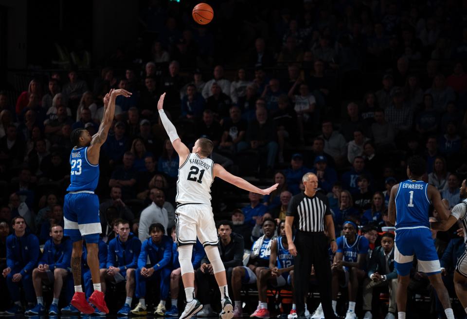 Kentucky Wildcats guard Jordan Burks (23) puts up a 3-pointer over Vanderbilt Commodores forward Tasos Kamateros (21) during the second half of their game at Memorial Gym in Nashville, Tenn., Tuesday, Feb. 6, 2024. The Wildcats beat the Commodores 109-77.
