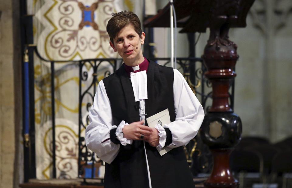 The Reverend Libby Lane reacts during a service where she was consecrated as the first female Bishop in the Church of England at York Minster in York