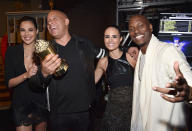 <p>Golden popcorn, anyone? Gal Gadot, Vin Diesel, Jordana Brewster, and Tyrese Gibson won a tub of it — though it probably wouldn’t be very tasty — when they took home the MTV Generation Award for the <em>Fast and the Furious </em>franchise at the 2017 MTV Movie And TV Awards. (Photo: Kevin Mazur/WireImage) </p>