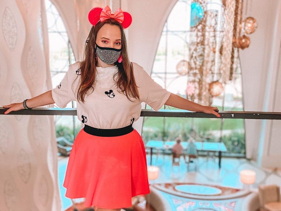 jenna posing in gran destino tower at disney's cornado springs resort 