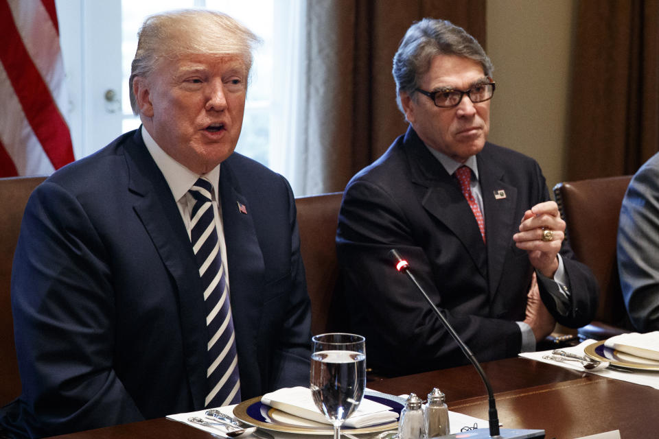 FILE - In this March 20, 2018, file photo, President Donald Trump speaks during a working lunch with Saudi Crown Prince Mohammed bin Salman in the Cabinet Room of the White House with Energy Secretary Rick Perry. Long after more flamboyant Cabinet colleagues fell out of Trump’s favor amid ethics scandals, low-profile Perry, the folksy former Texas governor, survived in part by steering clear of controversy as energy secretary. (AP Photo/Evan Vucci, File)