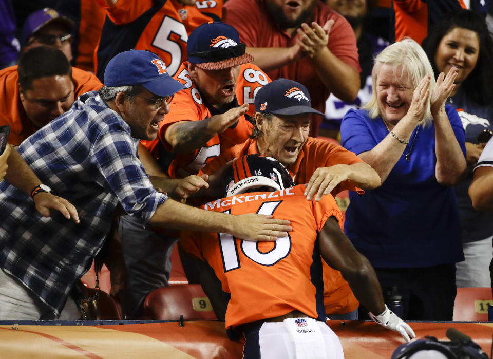 Denver Broncos wide receiver Isaiah McKenzie celebrates with fans after scoring during the first half in the team's NFL football preseason game against the Minnesota Vikings on Saturday, Aug. 11, 2018, in Denver. (AP Photo/Jack Dempsey)