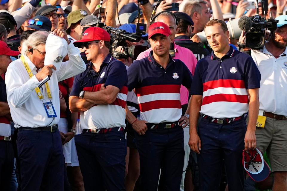 U.S. Ryder Cup captain Zach Johnson (left) and players Justin Thomas (center) and Jordan Spieth (right) watch one of the remaining singles matches on Oct. 1` on the final day of the Ryder Cup in Rome.