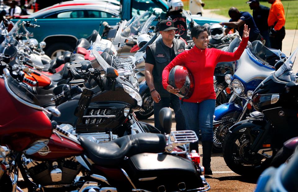 Jazzie Gibson with husband, Champ, of Cincinnati, Ohio, waves to fellow bikers at the National Bikers Roundup on Aug. 2, 2013, in Tunica. The 2023 National Bikers Roundup will be held at Liberty Park in Memphis.