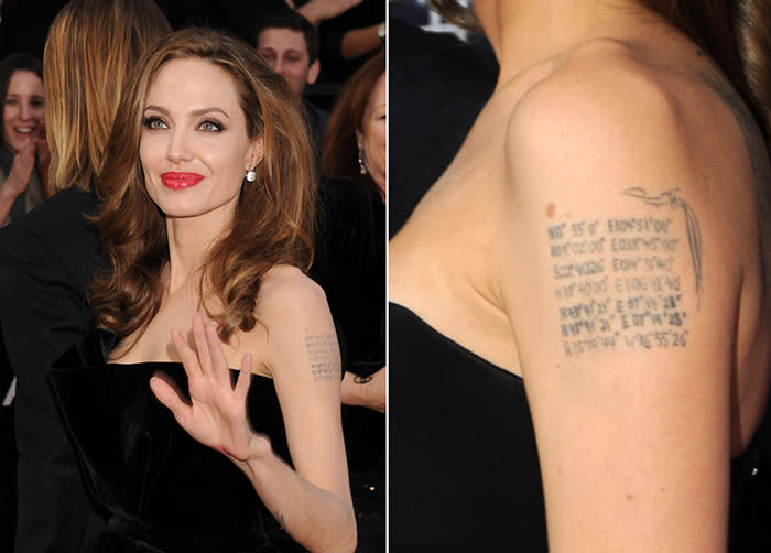 Angelina Jolie has multiple tattoos that mark the geographical location of where each of her children was born. (Photo: Getty Images)