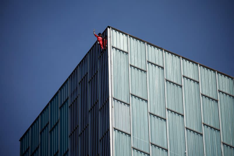 French "Spiderman" climbs building to raise awareness about drought and climate change, in Barcelona