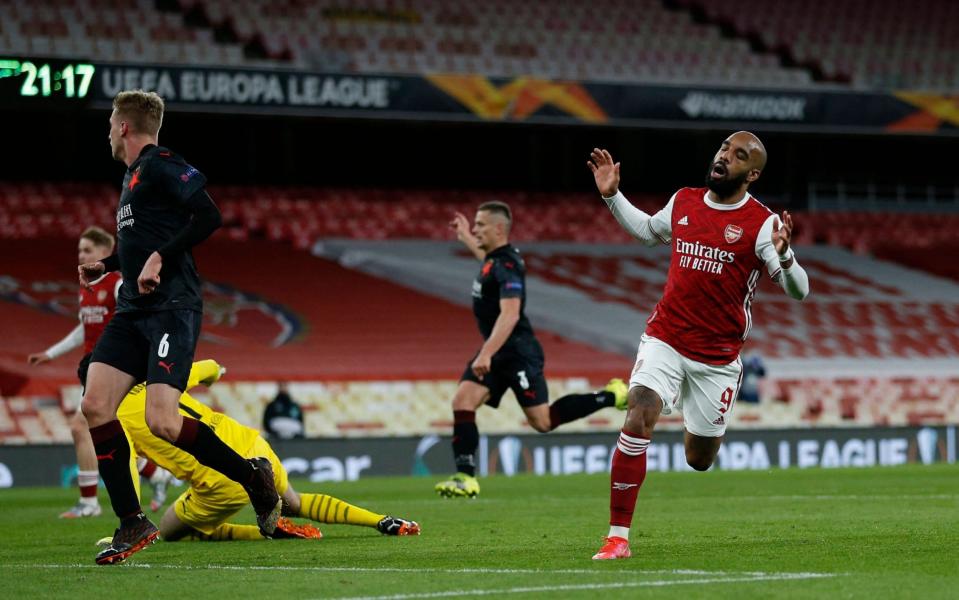 Arsenal's French striker Alexandre Lacazette (R) reacts after missing a chance during the UEFA Europa League quarter-final first leg football match between Arsenal and Slavia Prague at the Emirates Stadium in London on April 8, 2021. - GETTY IMAGES