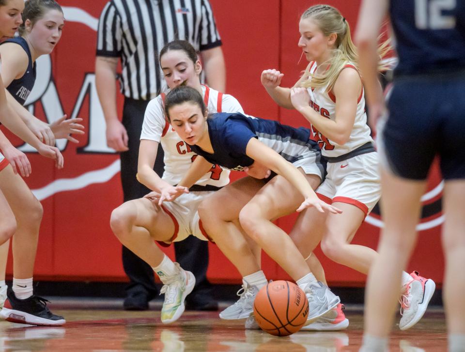 Fieldcrest's Ashlyn May, middle, battles for a loose ball with Dee-Mack's McKenna Carithers, right, and Dalia DeJesus in the second half Thursday, Feb. 2, 2023 in Mackinaw. The Knights defeated the Chiefs 62-54.