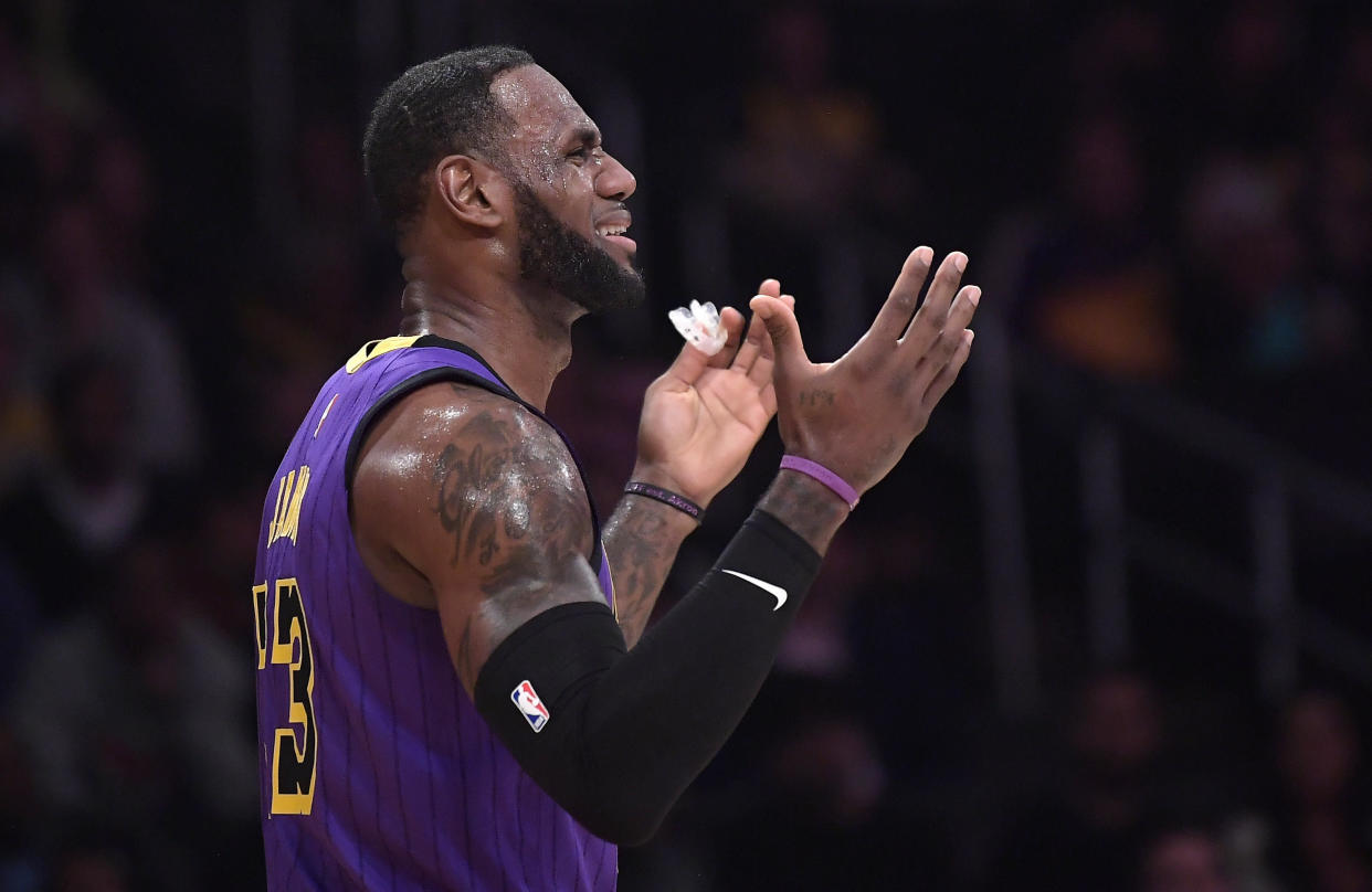 Los Angeles Lakers forward LeBron James reacts after being called for a foul during the first half of an NBA basketball game against the Brooklyn Nets Friday, March 22, 2019, in Los Angeles. (AP Photo/Mark J. Terrill)