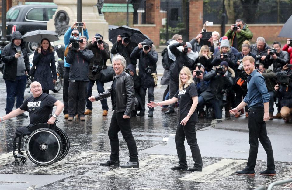 Prince Harry, Jon Bon Jovi and members of the Invictus Games Choir pose on the famous crossing at Abbey Road Studios (Getty Images)