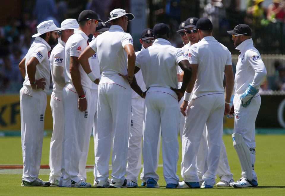 England's captain Alastair Cook (3rd R) talks to his team before the start of Australia's inning during the third day of the second Ashes test cricket match at the Adelaide Oval December 7, 2013.