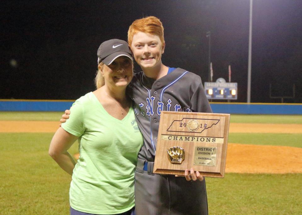 Hayden Harris and his mom, Cristy Harris, at a championship baseball game in McNairy County, Tennessee, in 2018.