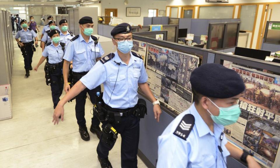 Police officers inside Apple Daily headquarters, August 2020.