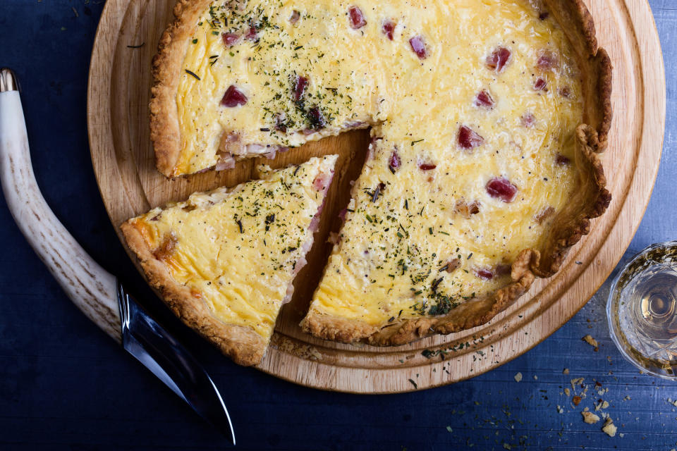 A homemade quiche cut into slices