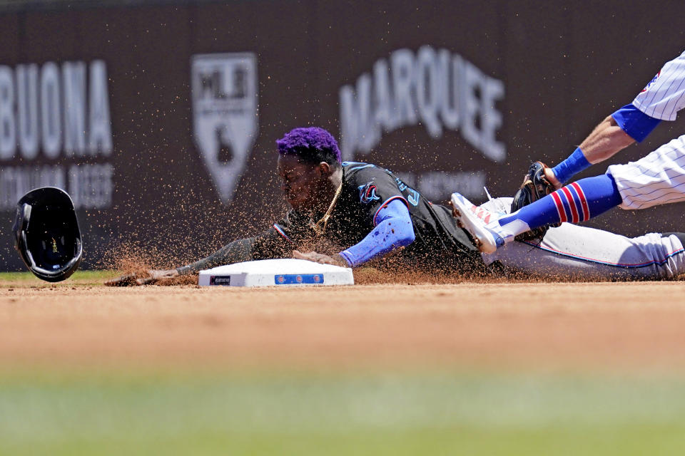 Miami Marlins' Jazz Chisholm Jr., left, steals second as Chicago Cubs second baseman Eric Sogard applies a late tag during the first inning of a baseball game in Chicago, Saturday, June 19, 2021. (AP Photo/Nam Y. Huh)