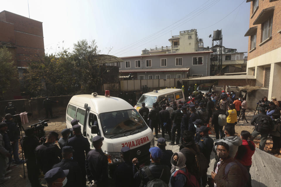 An ambulance carrying bodies of victims of a plane crash arrives at a hospital in Kathmandu, Nepal, Tuesday, Jan. 17, 2023. Nepalese authorities on Tuesday began returning to families the bodies of victims of a flight that crashed Sunday, and said they were sending the aircraft's data recorder to France for analysis as they try to determine what caused the country's deadliest plane accident in 30 years. (AP Photo/Bikram Rai)