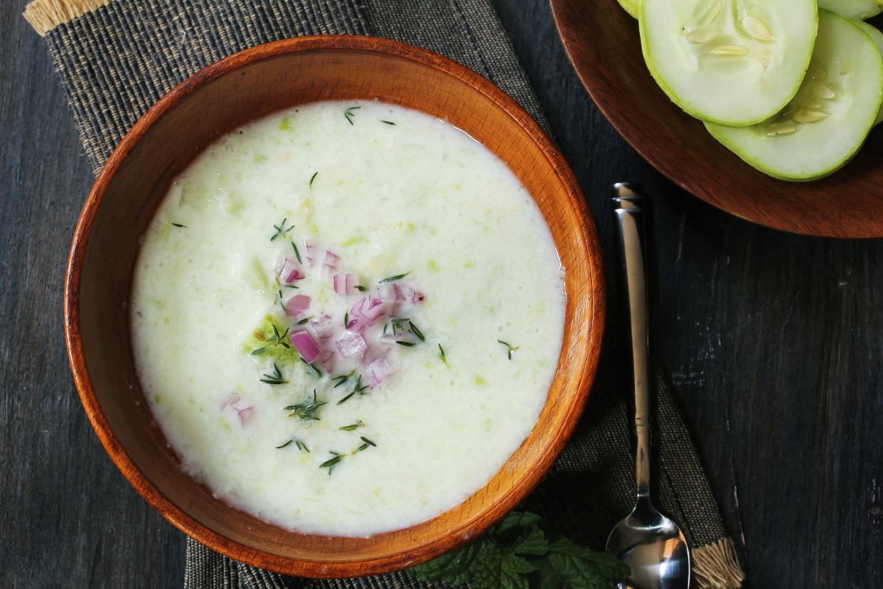 Chilled Cucumber Soup on dark moody background, selective focus