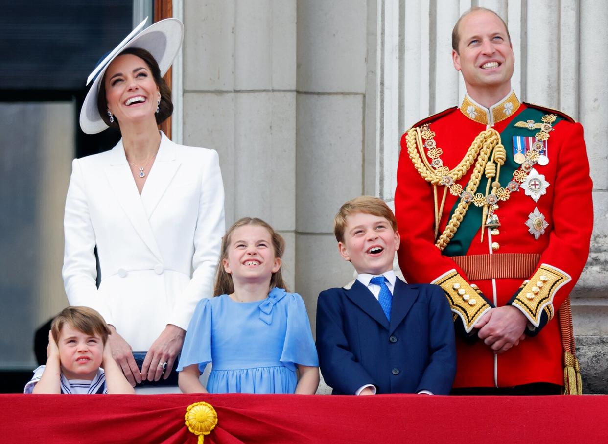Prince Louis of Cambridge, Catherine, Duchess of Cambridge, Princess Charlotte of Cambridge, Prince George of Cambridge and Prince William, Duke of Cambridge watch a flypast from the balcony of Buckingham Palace during Trooping the Colour