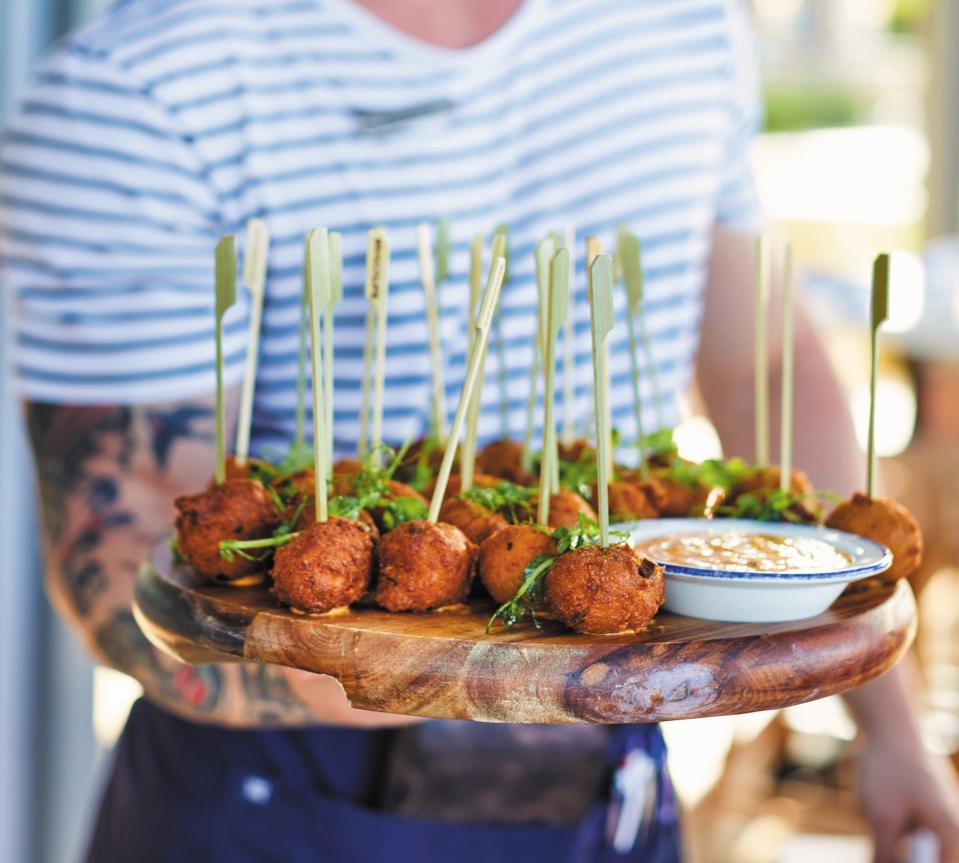 No matter what the outcome of the Super Bowl, crawfish hush puppies are a touchdown of flavor with a two-point conversion at Lucky Shuck.