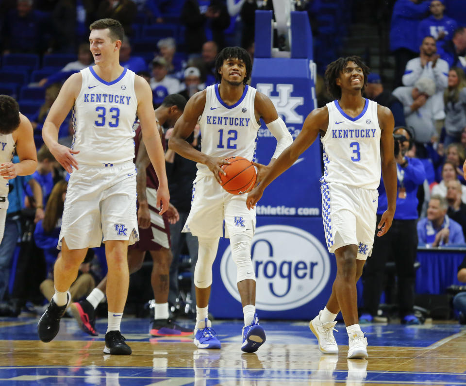 Kentucky Wildcats guard Tyrese Maxey (3) forward Keion Brooks (12) and forward Ben Jordan (33) celebrate at the end of the game against the Eastern Kentucky Colonels at Rupp Arena. Mandatory Credit: Mark Zerof-USA TODAY Sports