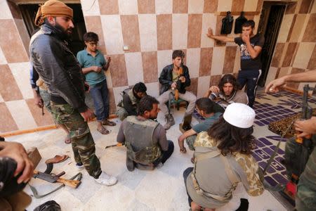 Rebel fighters of 'Al-Sultan Murad' brigade gather on the outskirts of the northern Syrian town of Shawa, which is controlled by Islamic State militants, in Aleppo Governorate, Syria, September 28, 2016. REUTERS/Khalil Ashawi