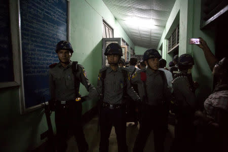 Myanmar Police stand guard at the forensic department of a hospital where the body of Ko Ni is kept, a prominent member of Myanmar's Muslim minority and legal adviser for Myanmar's ruling National League for Democracy, in Yangon, Myanmar, January 29, 2017. Picture Taken January 29, 2017. REUTERS/Aung Kyaw Htet EDITORIAL USE ONLY. NO RESALES. NO ARCHIVE.