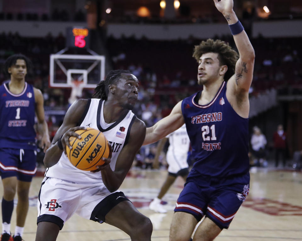 San Diego State forward Jay Pal drives against Fresno State's Isaiah Pope during the first half of an NCAA college basketball game in Fresno, Calif., Saturday, Feb. 24, 2024. (AP Photo/Gary Kazanjian)