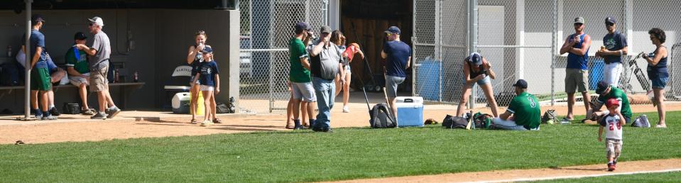 The Sartell Muskies hang out with each other and their families after defeating Becker on Saturday 9-4 in the Sauk Valley League championship and Region 11C seeding game at St. Cloud Orthopedic Field.