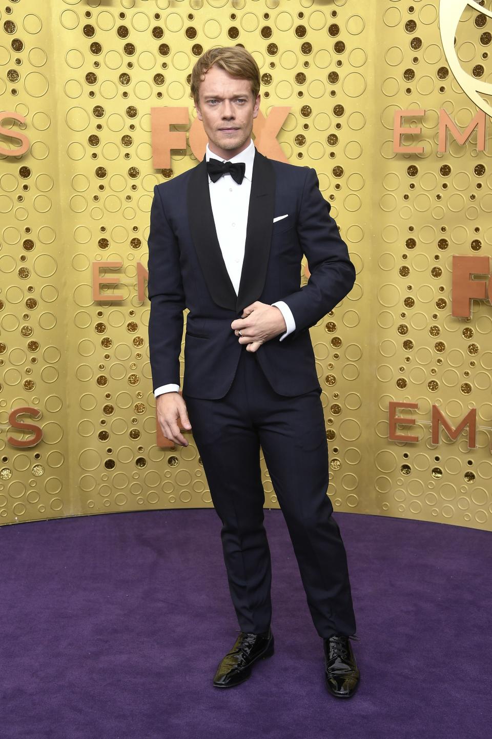 Alfie Allen in a Dunhill tux and Omega watch