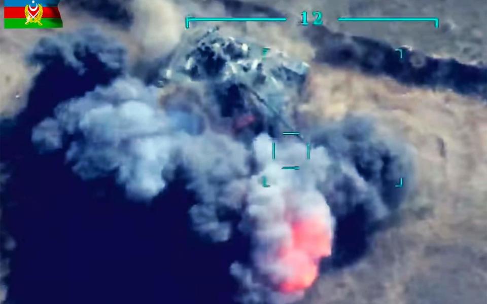 Aerial footage released by Azerbaijan’s defence ministry showed Armenian military vehicles exploding after being targeted by weaponised drones.  - Azerbaijan defence ministry