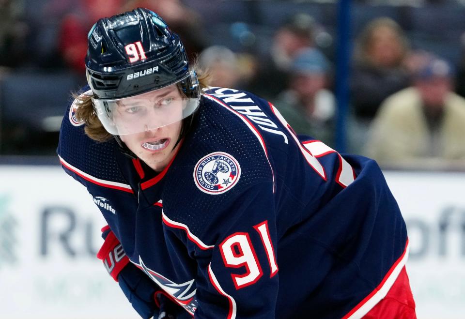 Dec 19, 2022; Columbus, Ohio, USA; Columbus Blue Jackets center Kent Johnson (91) waits for a face-off against Dallas Stars during the third period of their NHL game at Nationwide Arena.